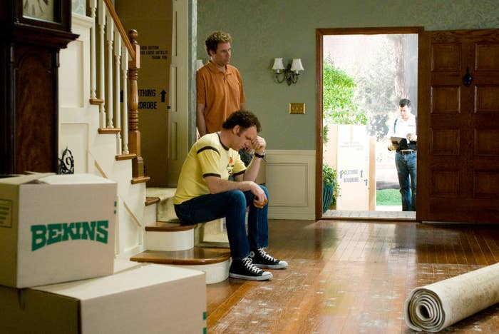 John C. Reilly and Will Ferrell sitting in a house with moving boxes in Step Brothers