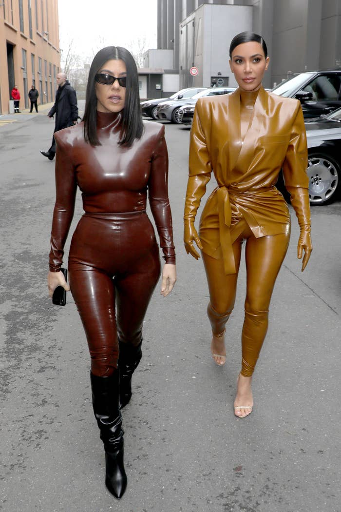 Kim and kourtney walking outside