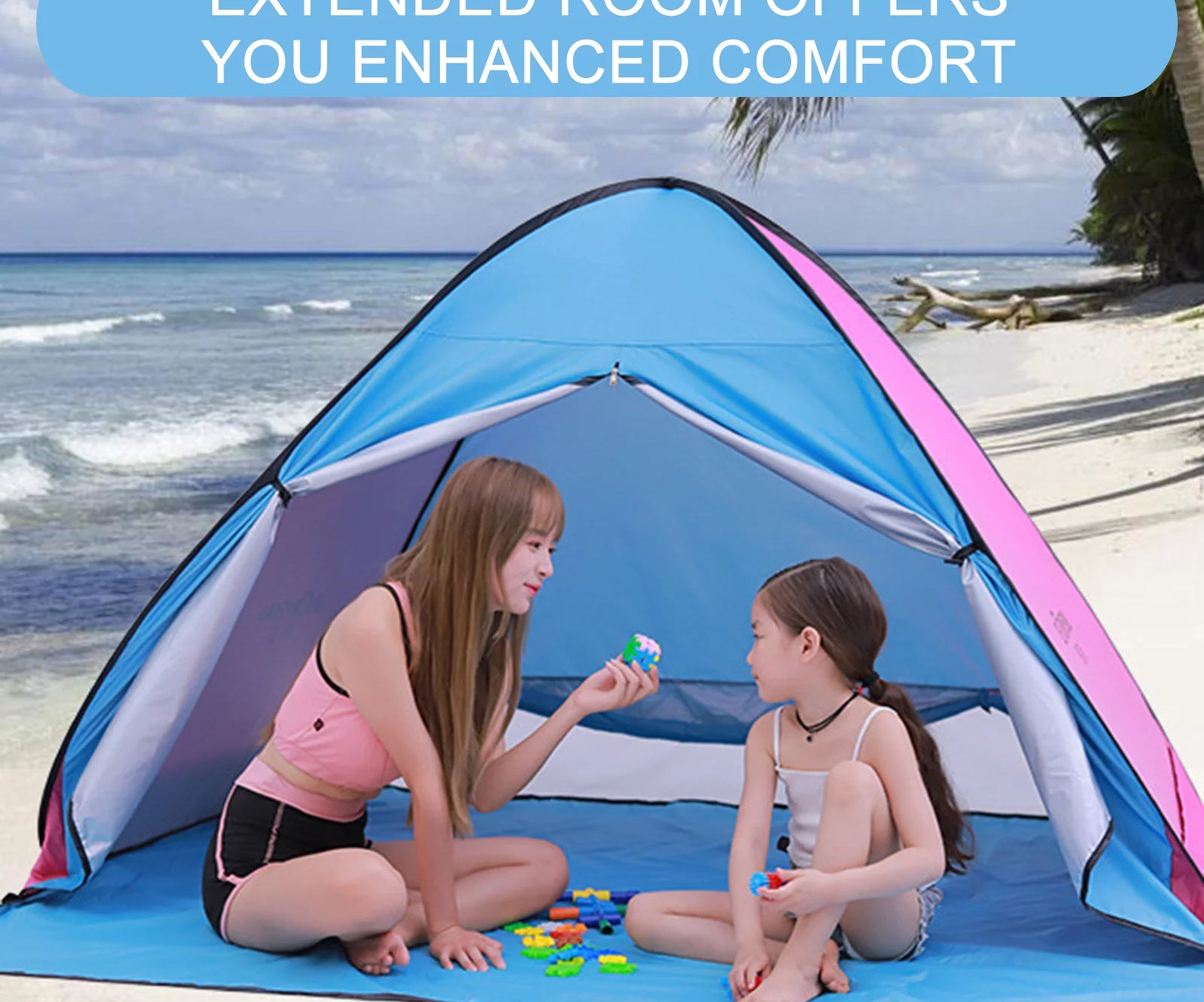 Adult and child in beach tent