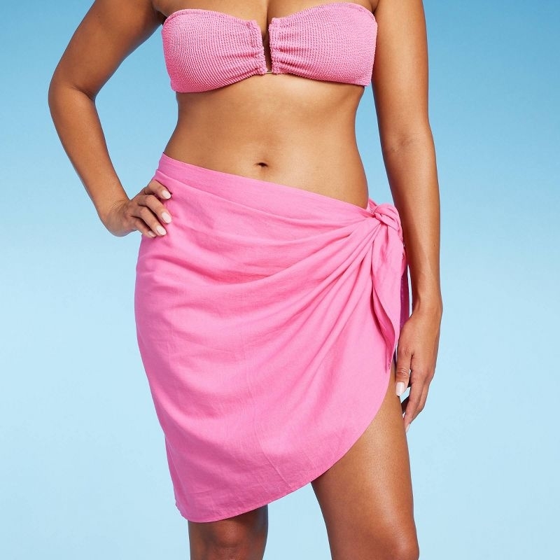 Model wearing the pink sarong