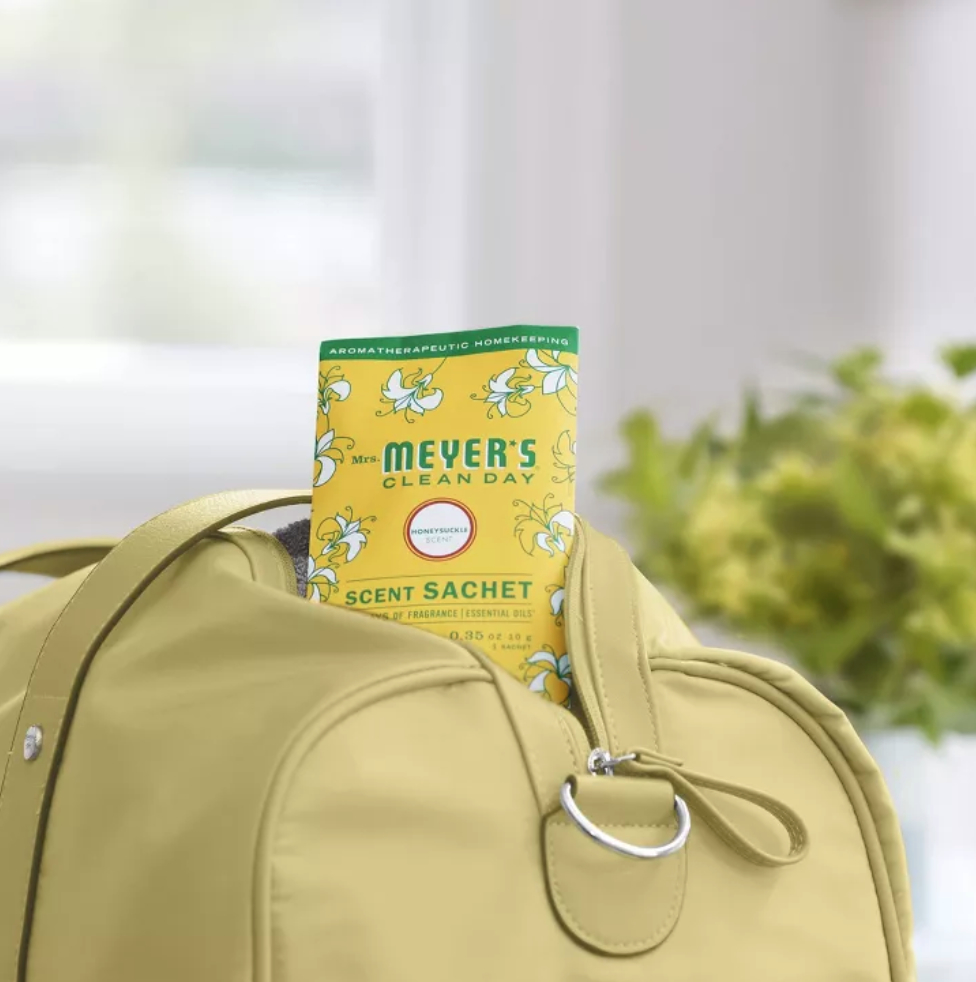 A Mrs. Meyer&#x27;s scent sachet coming out of a duffel bag