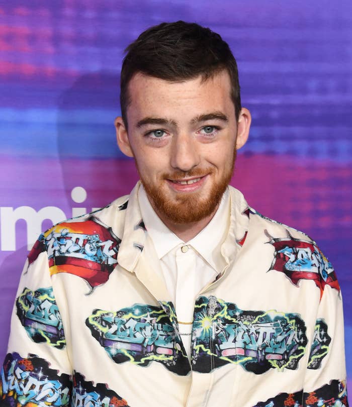 Close-up of Angus smiling at a press event