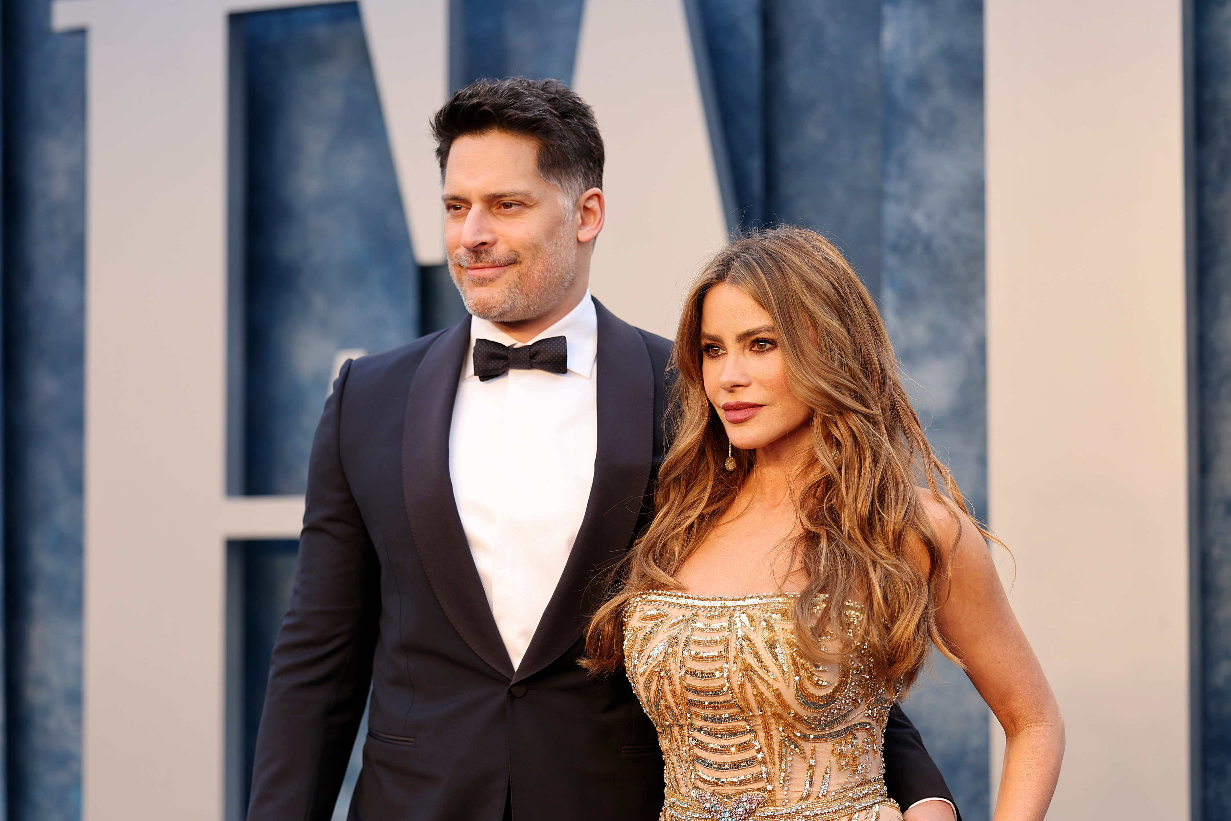 Close-up of Joe in a tuxe and Sofía in a gown at a media event
