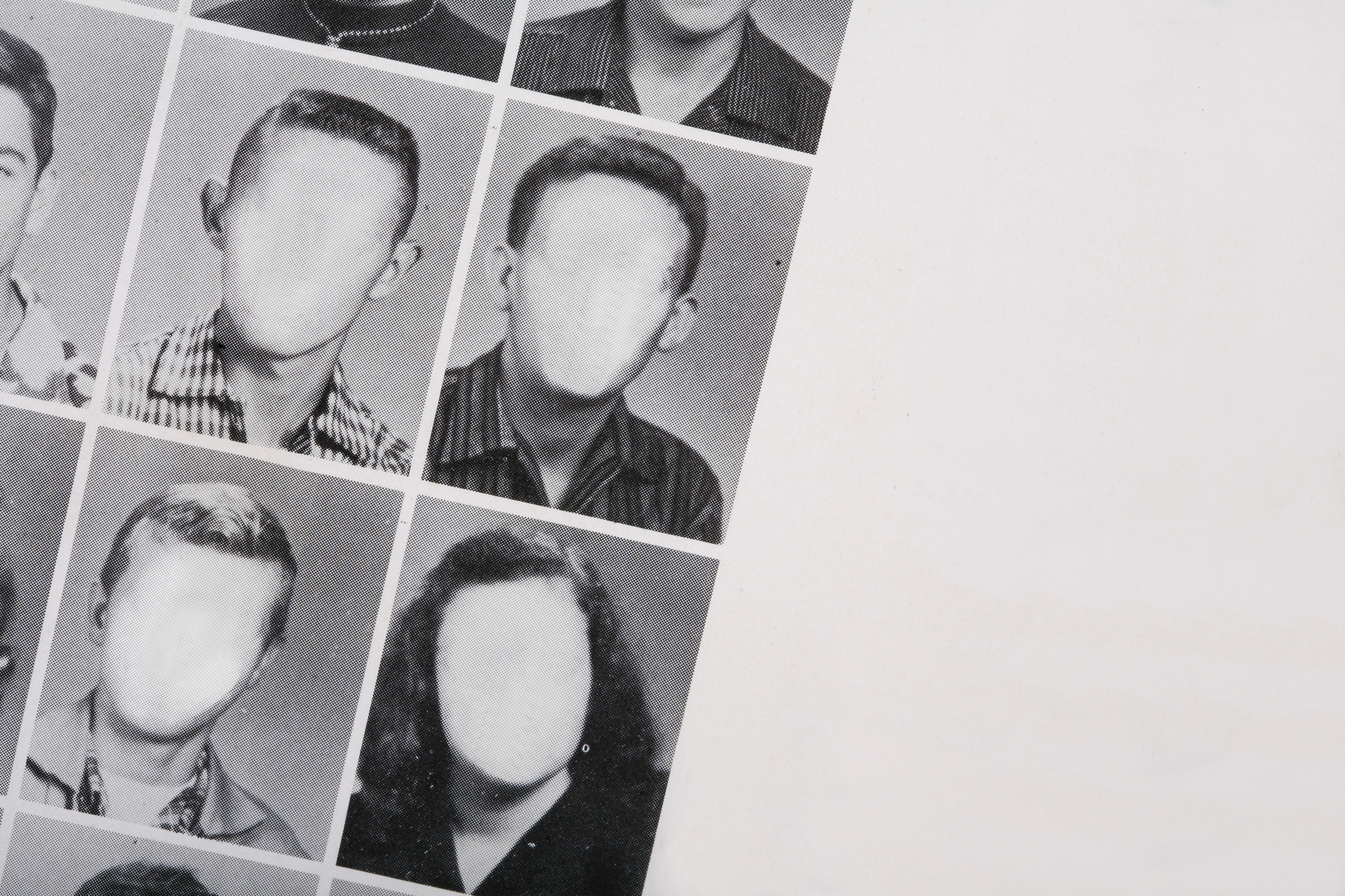 A yearbook with all the faces blurred out