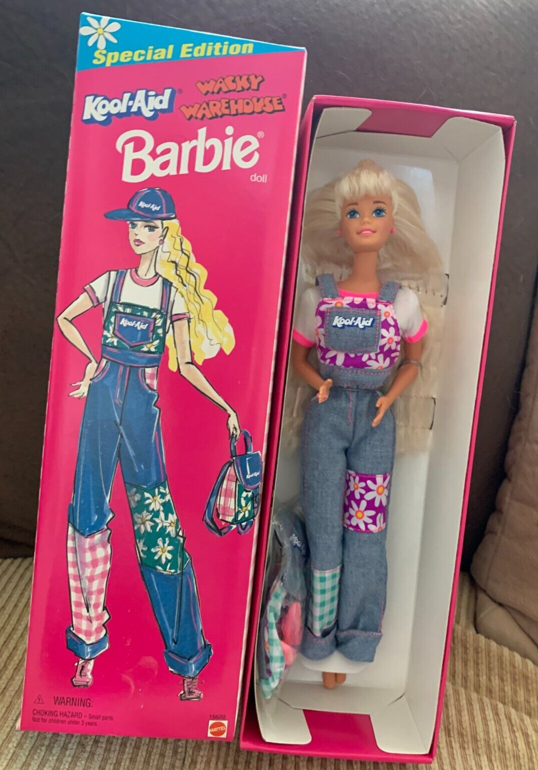 barbie wearing overalls in the box
