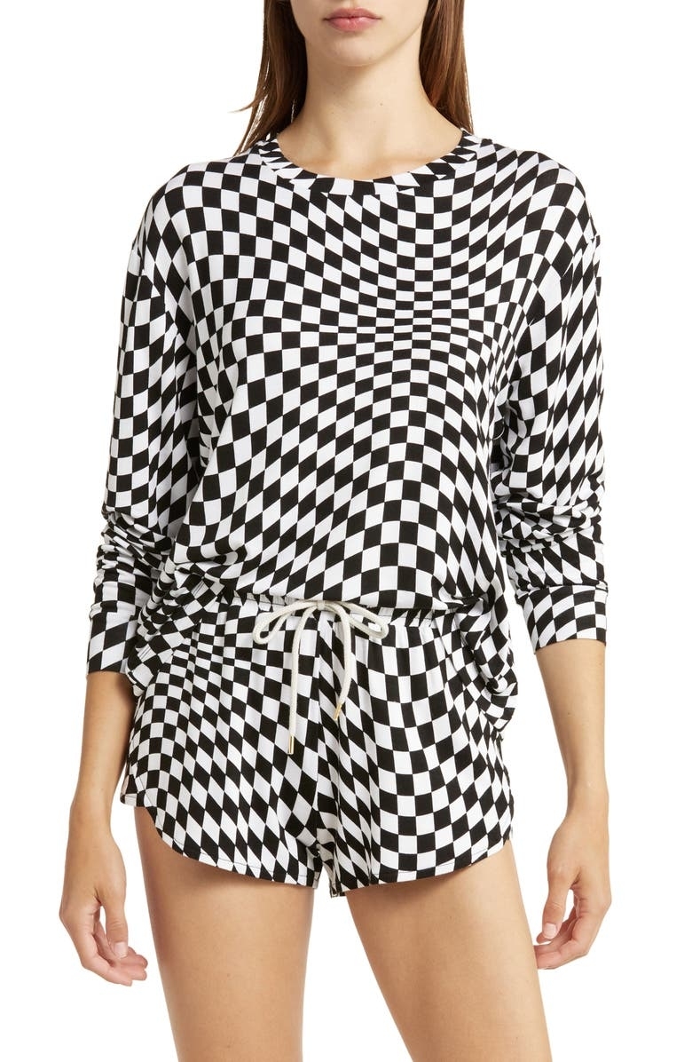 model in long sleeve and shorts curvy checkerboard print pj set
