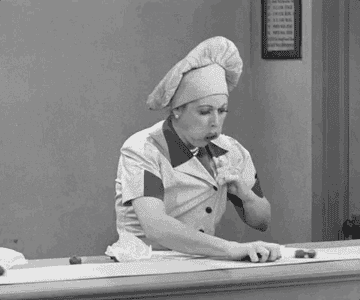 Lucille Ball I love lucy workign in chocolate factory eating and stashing chocolates on conveyor belt