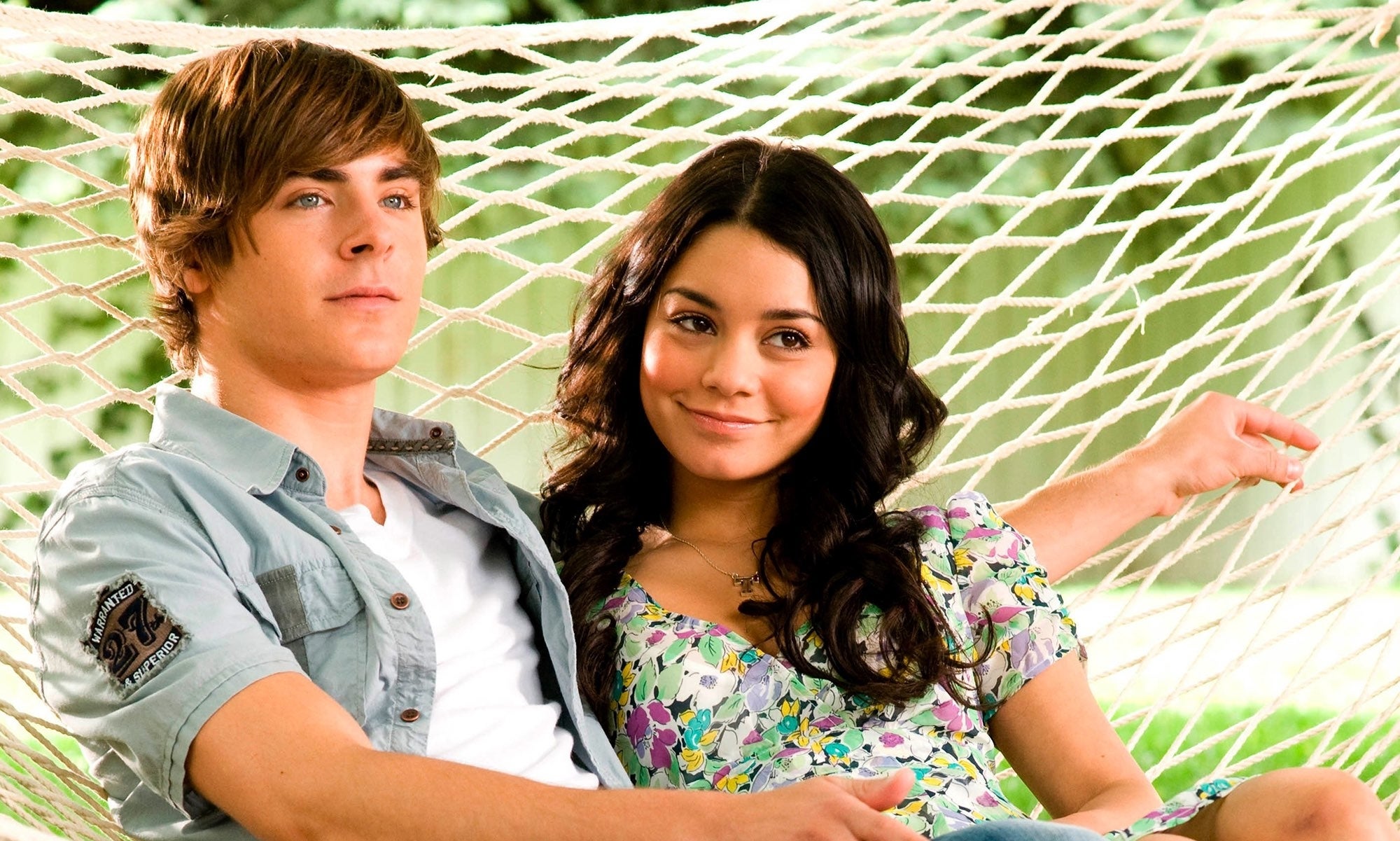 Close-up of Zac and Vanessa sitting together in a movie scene