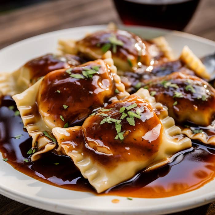 Ravioli on a plate saturated in root beer