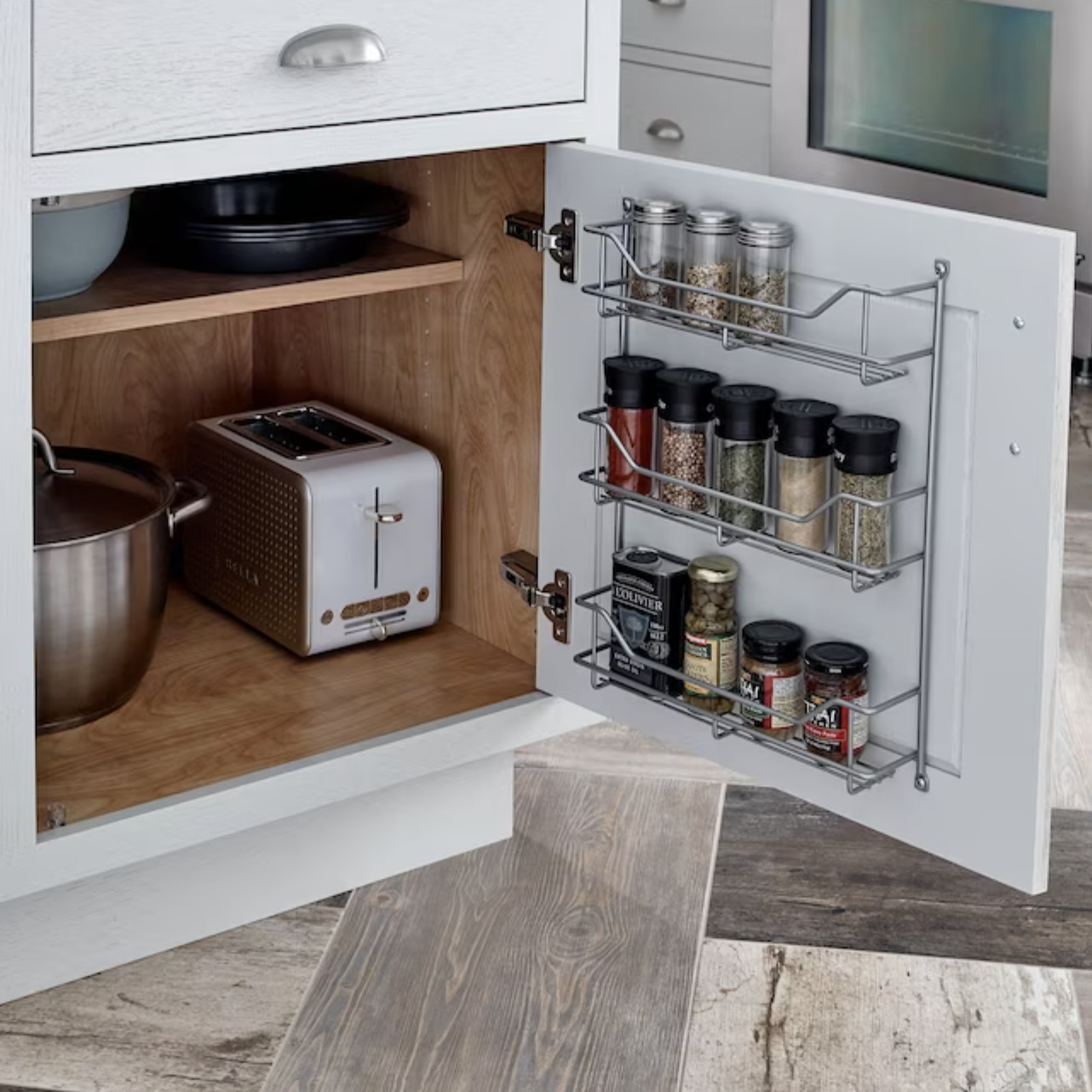 rack attached to inside of cabinet with spices