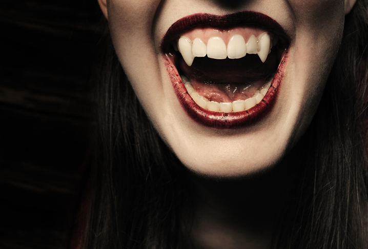Close-up of a person with fangs