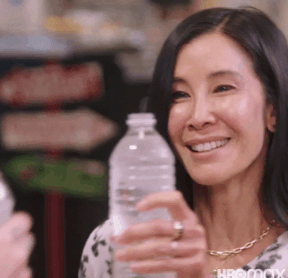 people clinking water bottles together on takeout with lisa ling