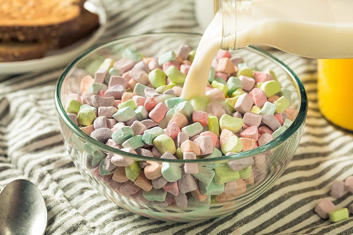 milk being poured into bowl of marshmallows