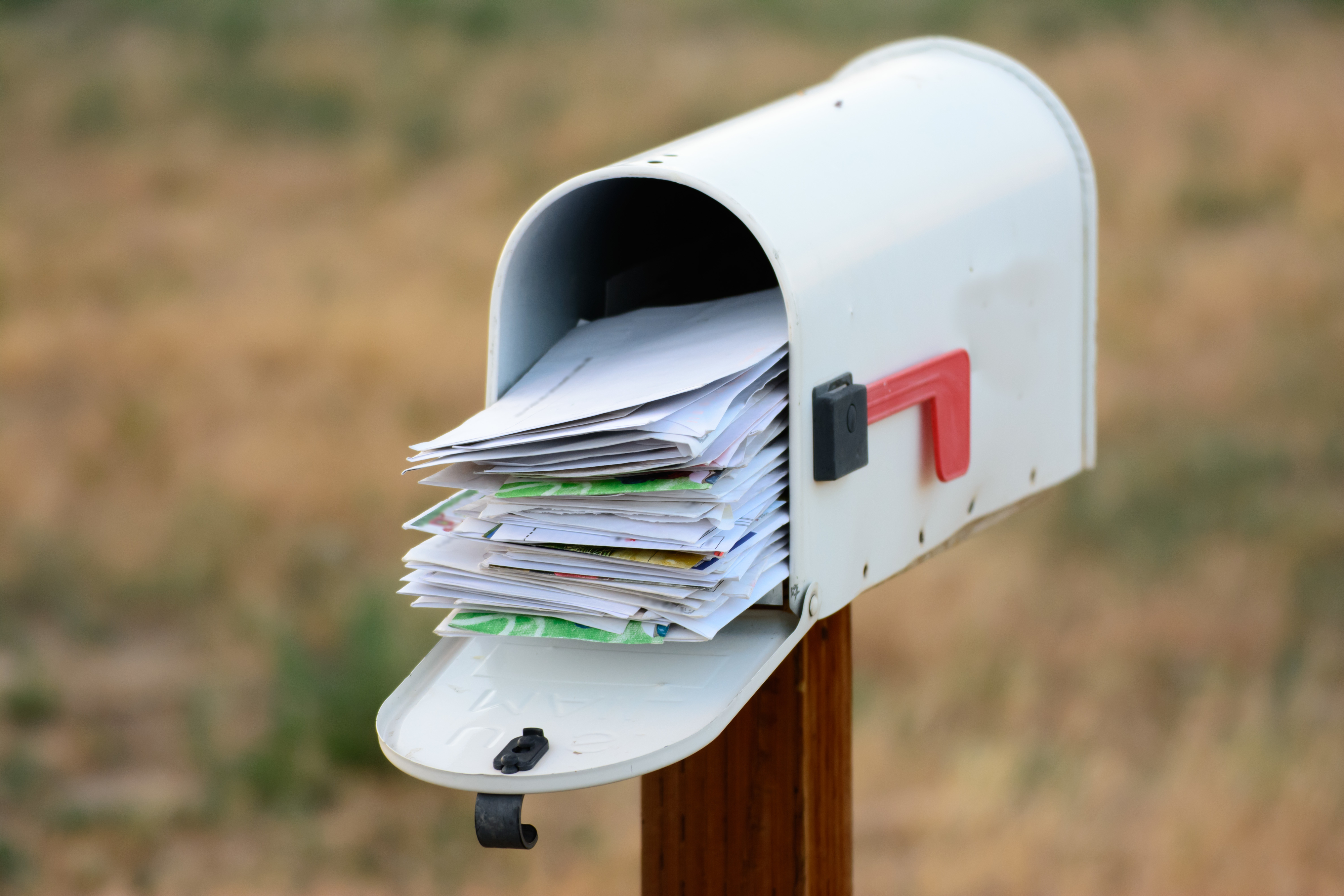 Mailbox overflowing with letters
