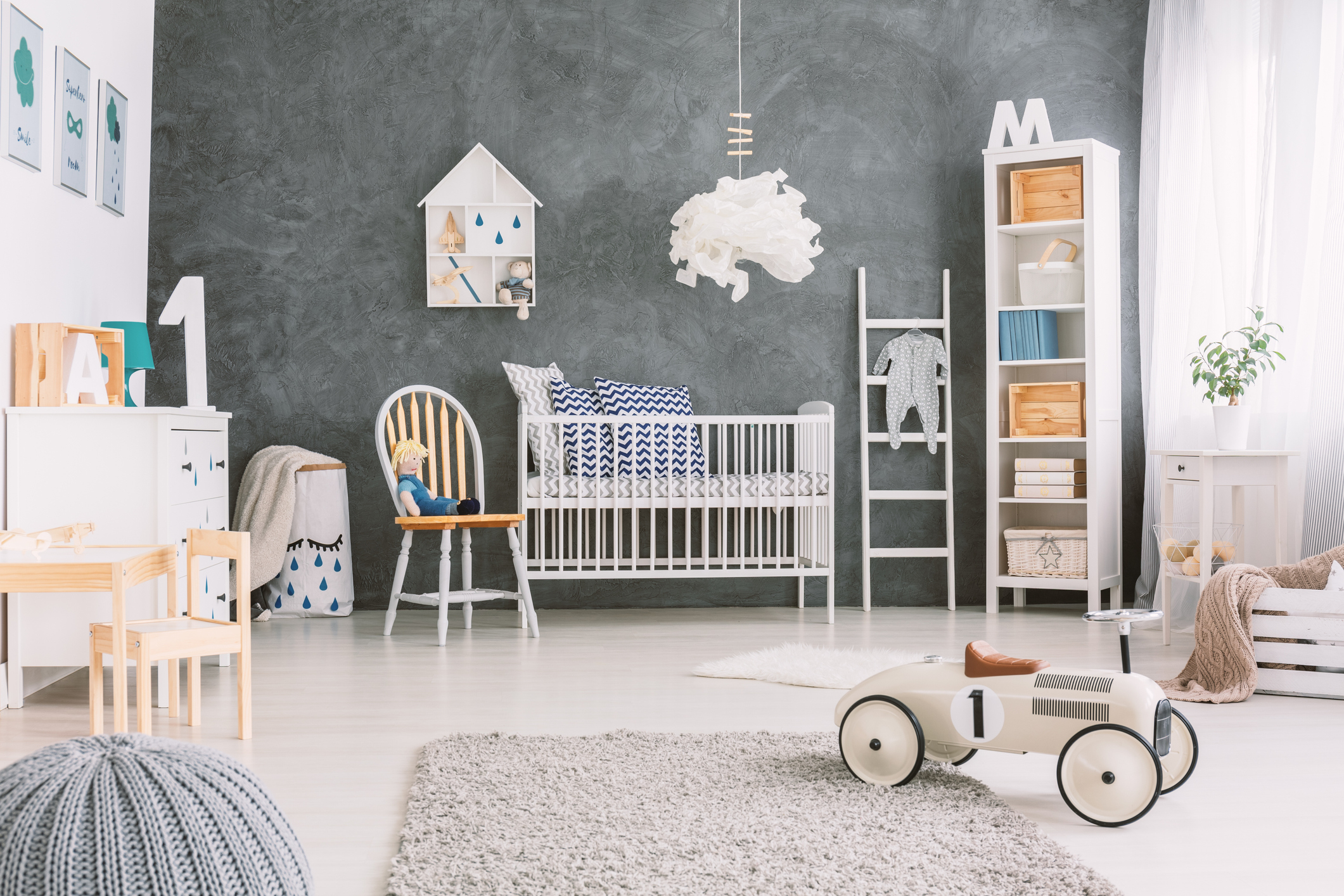 Child&#x27;s room with grey wall and toys