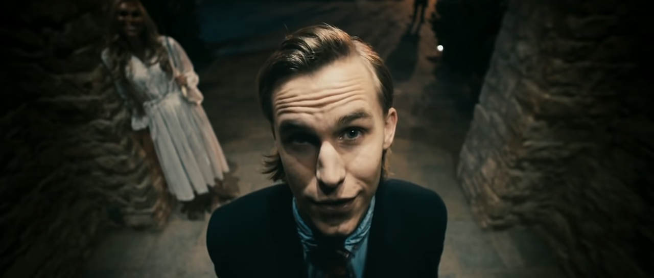 Close-up of Rhys Wakefield as the Polite Leader