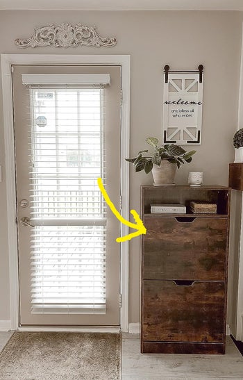 reviewer's dark wood cabinet