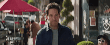 paul rudd smiling while walking down the street