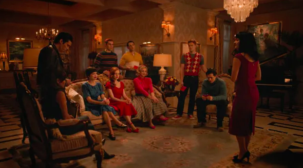 The main characters of Riverdale sit and stand in Veronica&#x27;s huge and fancy apartment. They are dressed in traditional 1950s apparel.