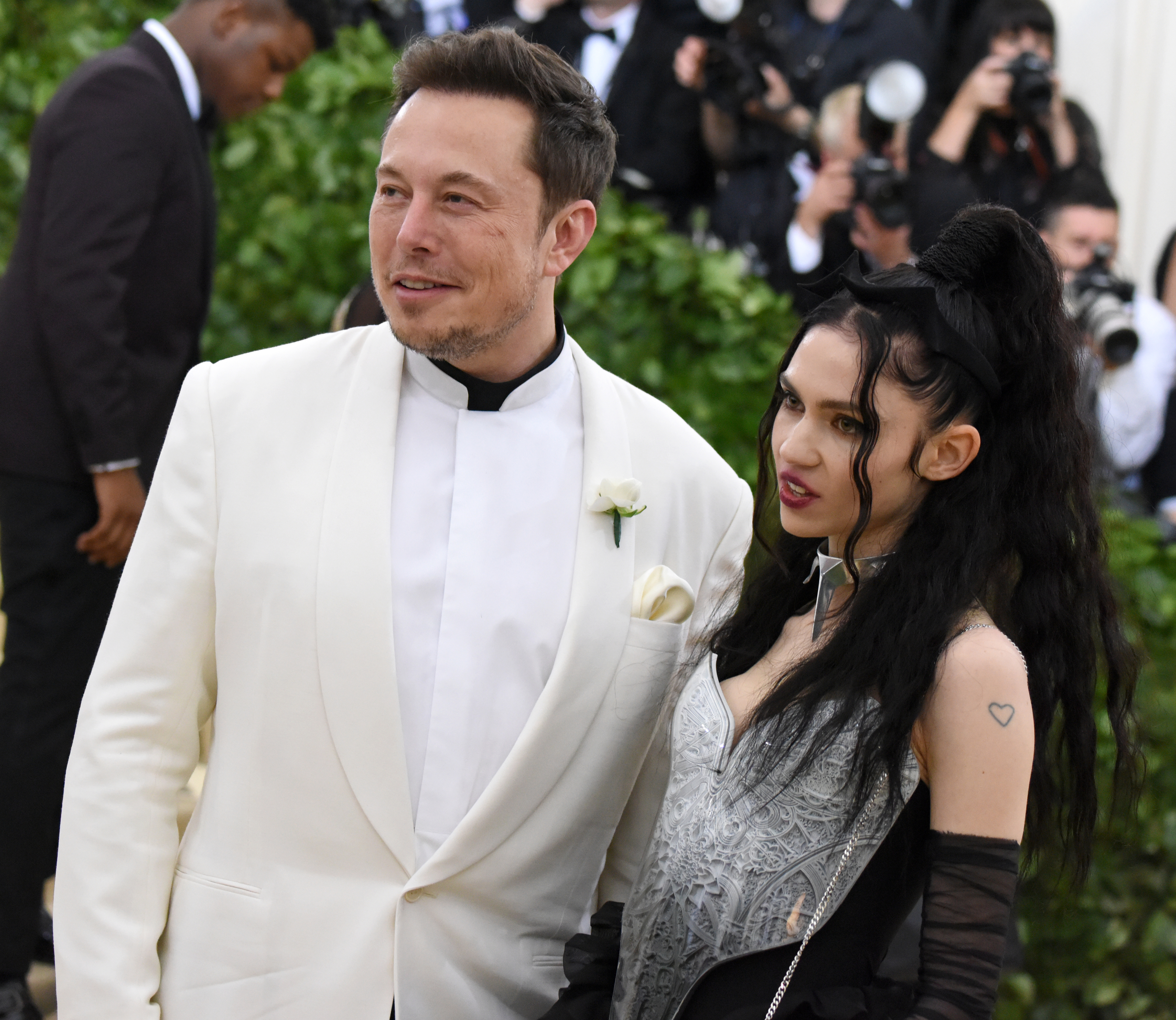 closeup of grimes and elon at the met