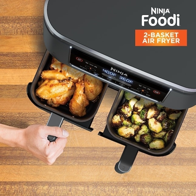 the two basket air fryer with veggies in one basket and chicken in the other