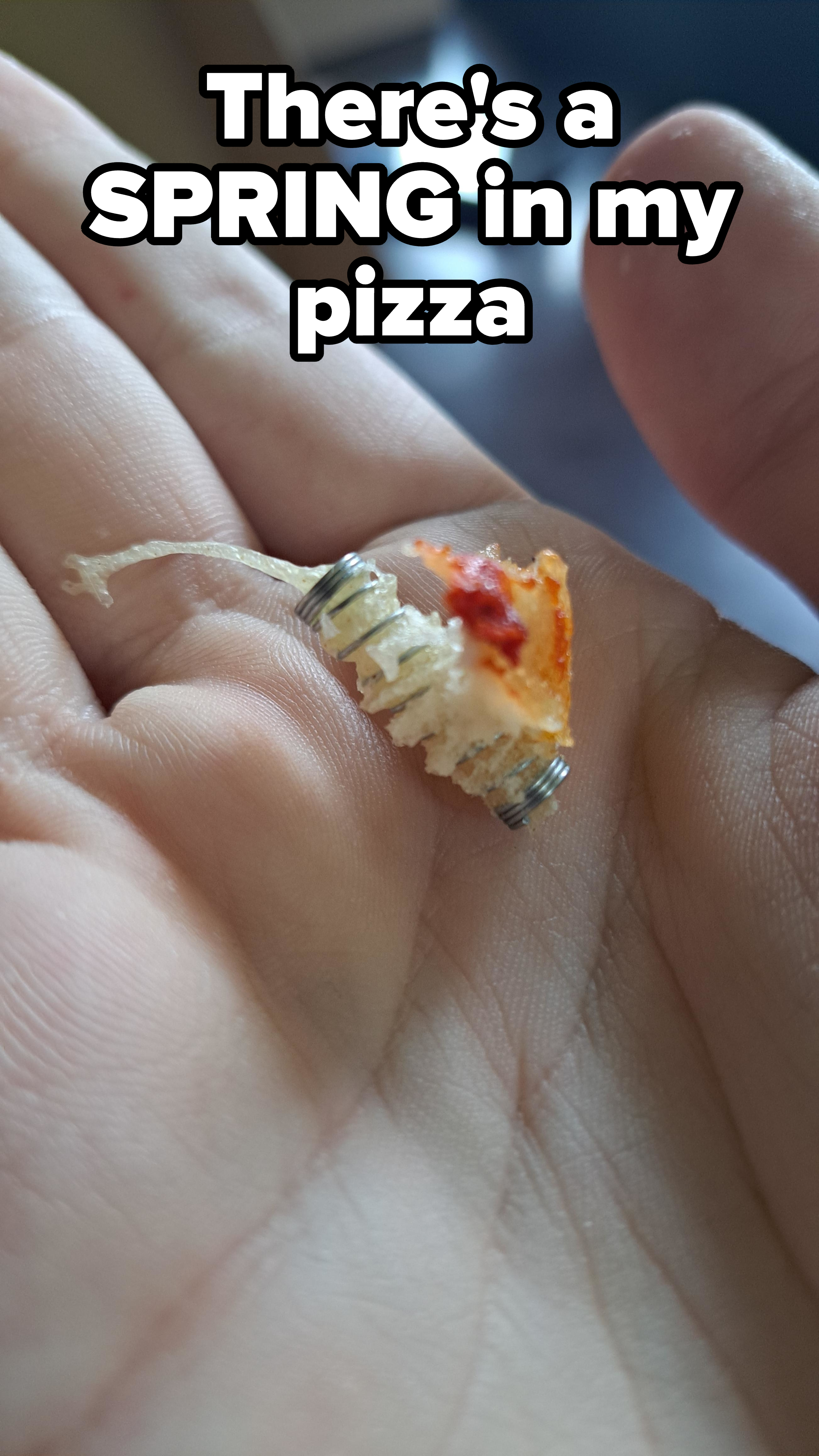 A spring in a bite of pizza