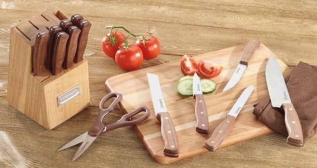 the knife block with knives out on a cutting board