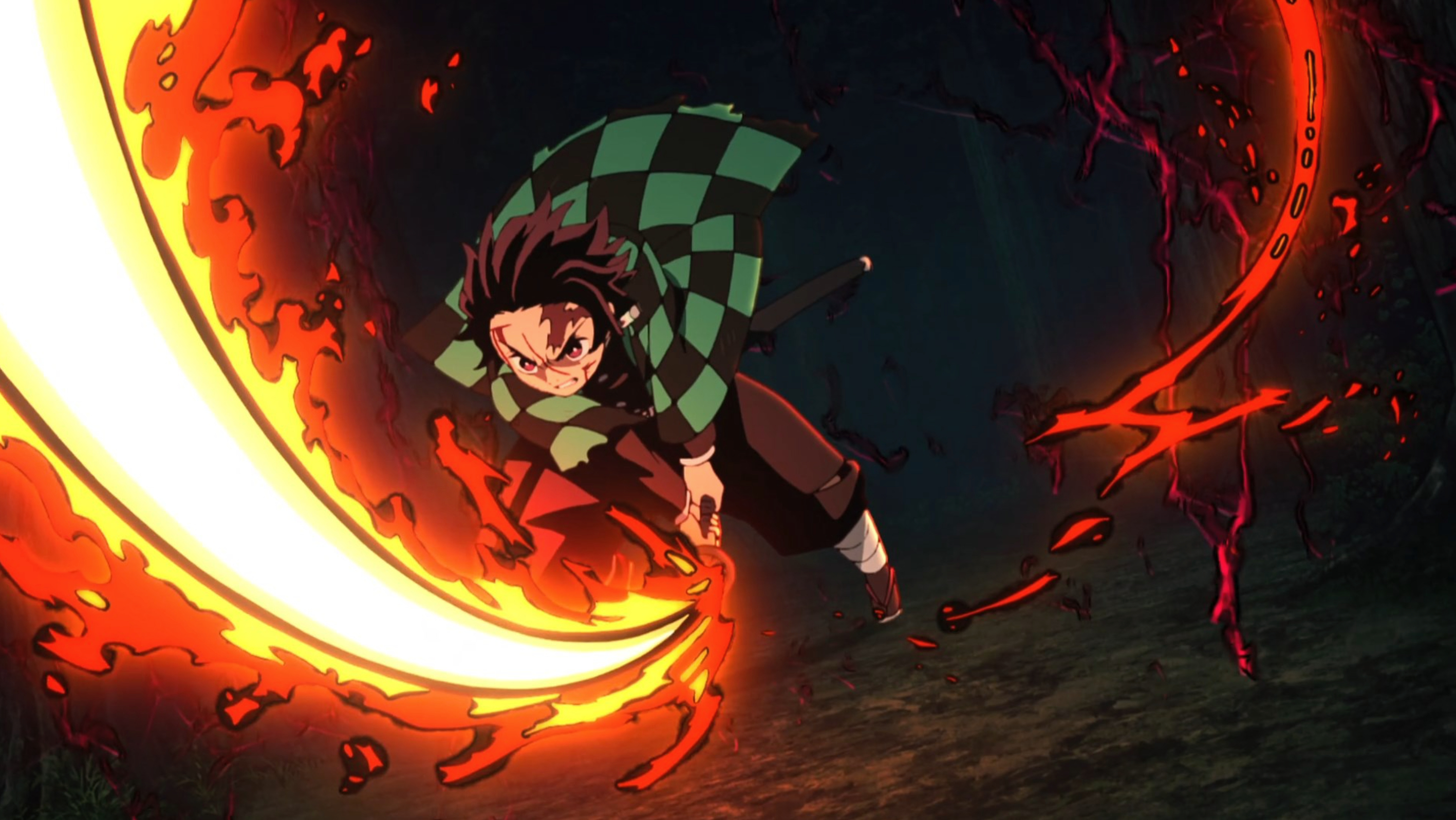 Tanjiro releasing circular flames from his sword while performing Hinokami Kagura