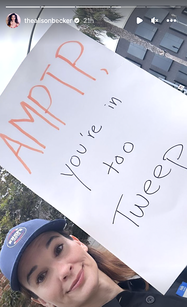 selfie of her holding a sign
