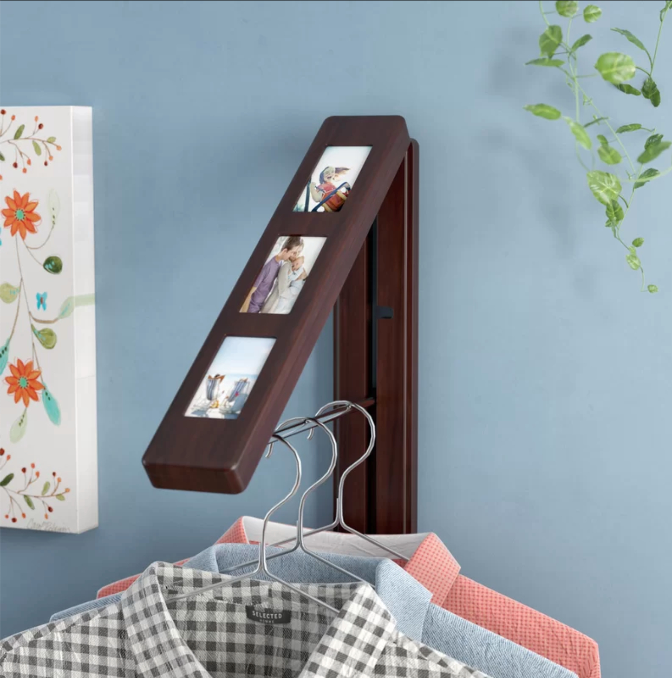 a wooden picture frame with a secret hanger function