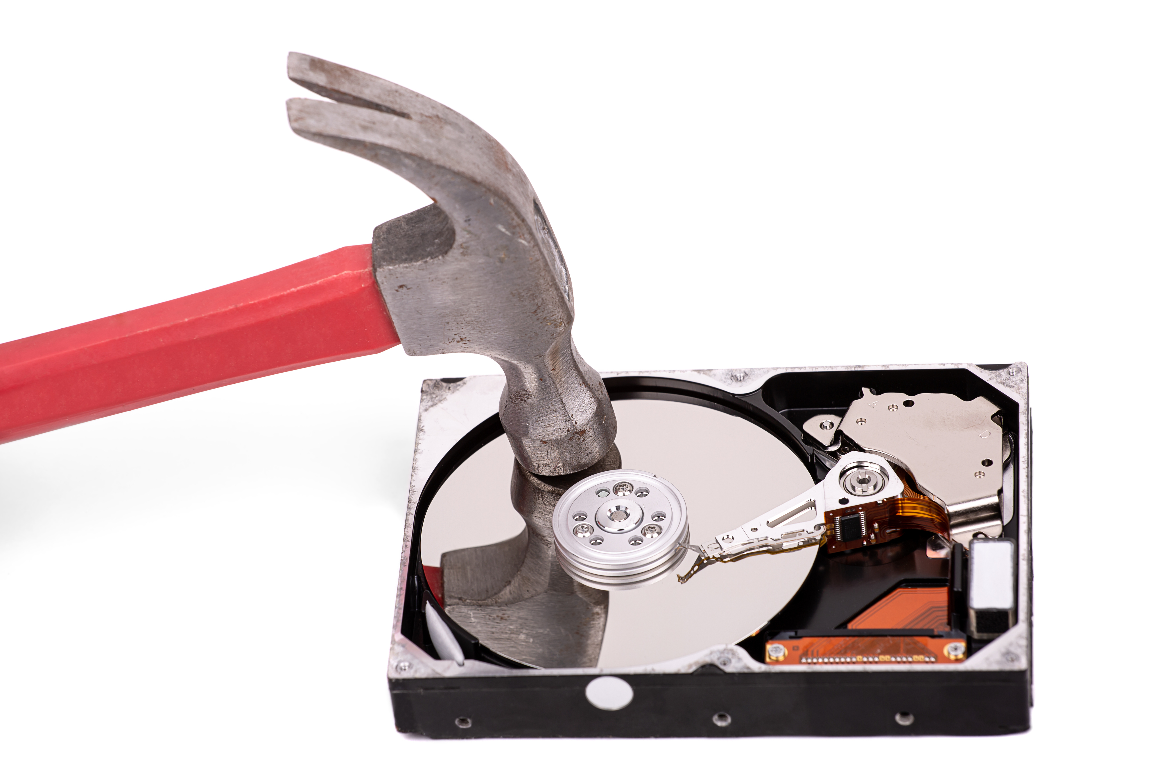A hammer destroying a hard drive