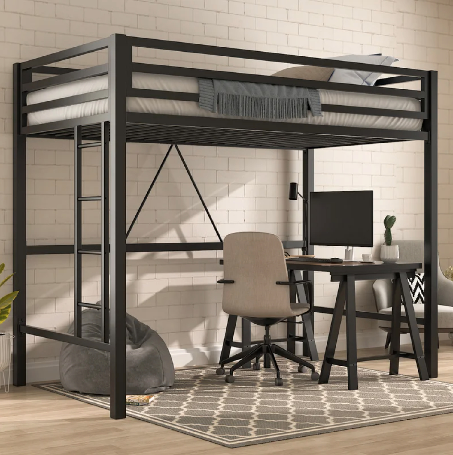 a black lofted bed frame with a desk set up and beanbag chair below it