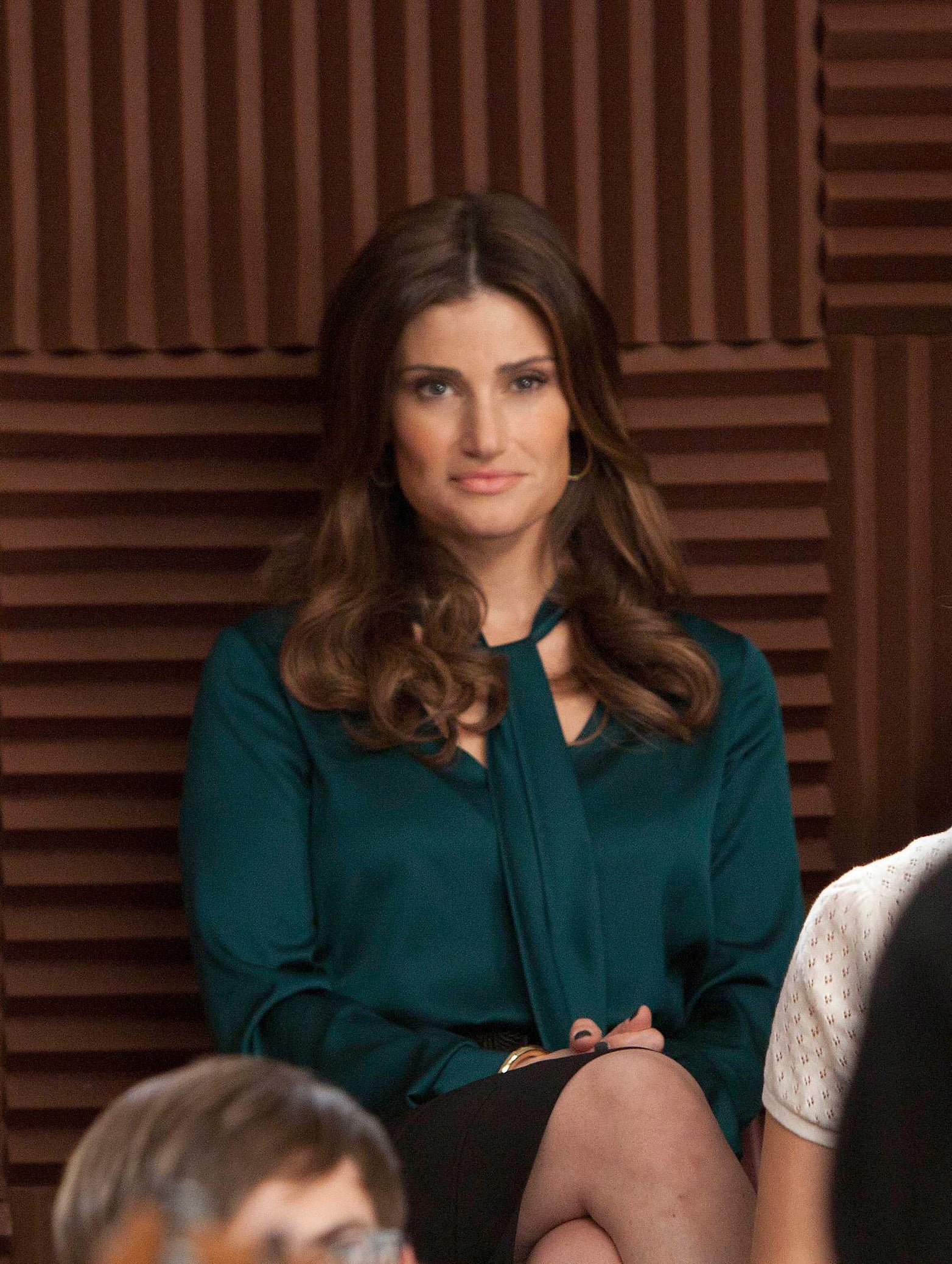 Idina sitting in the stands in the series