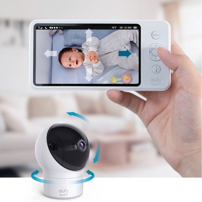 model holding the baby monitor while the camera shows it&#x27;s 360 degree capabilities