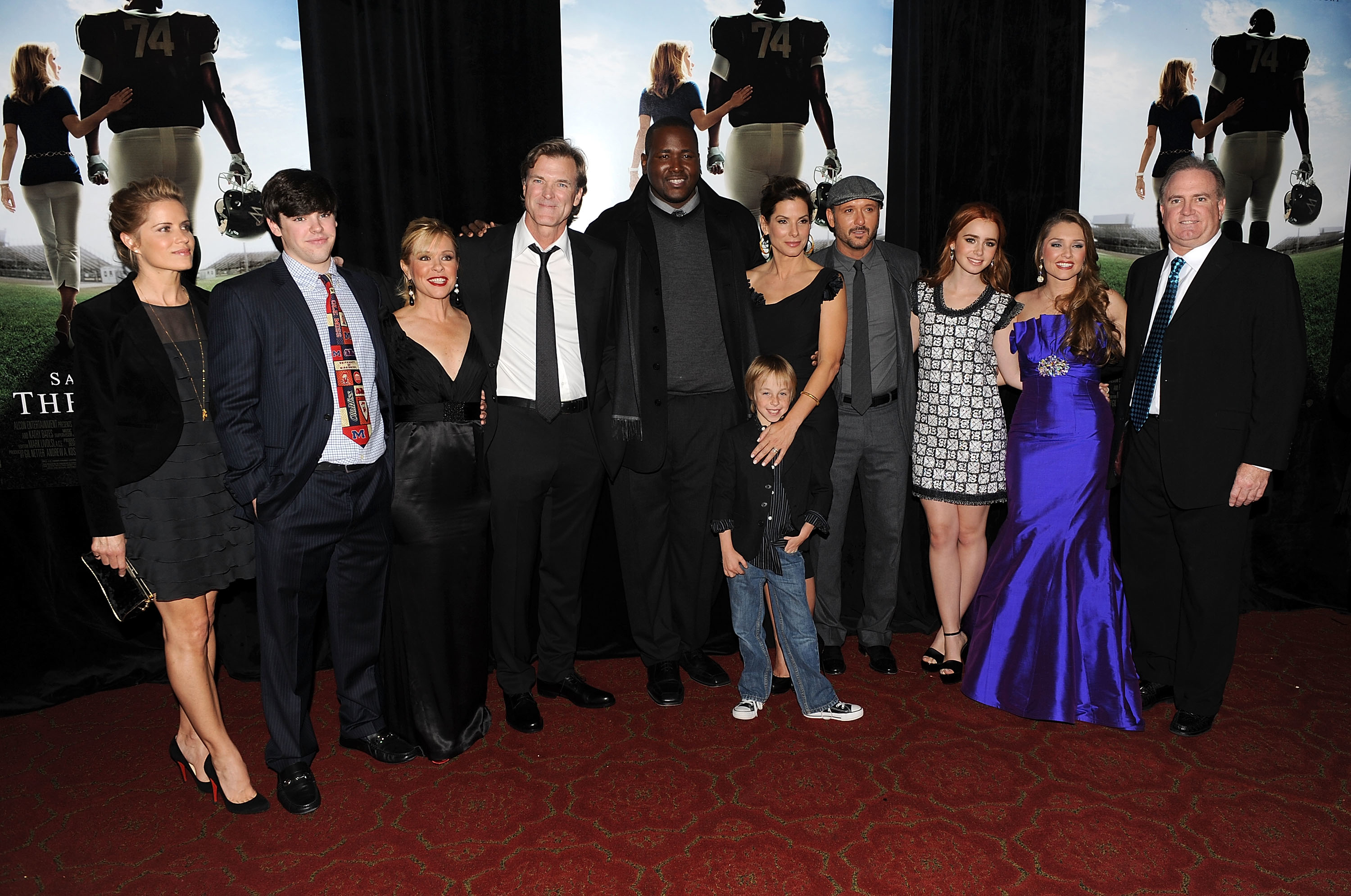 The cast of &quot;The Blind Side&quot; with the Tuohys on the red carpet