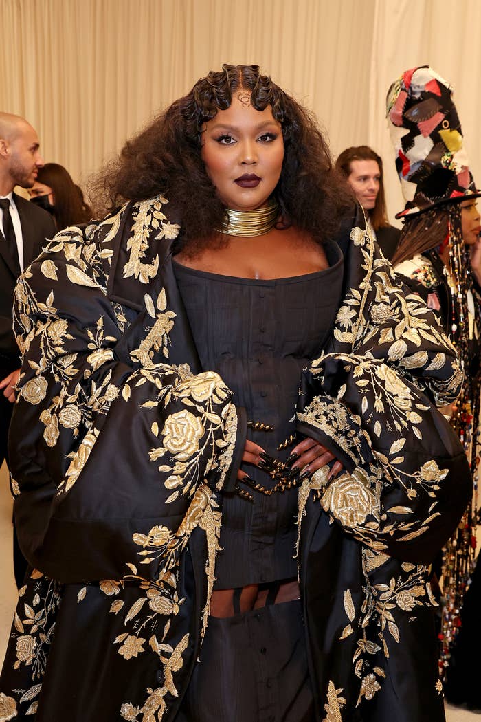 Closeup of Lizzo in an ornate embroidered coat at the MET Gala