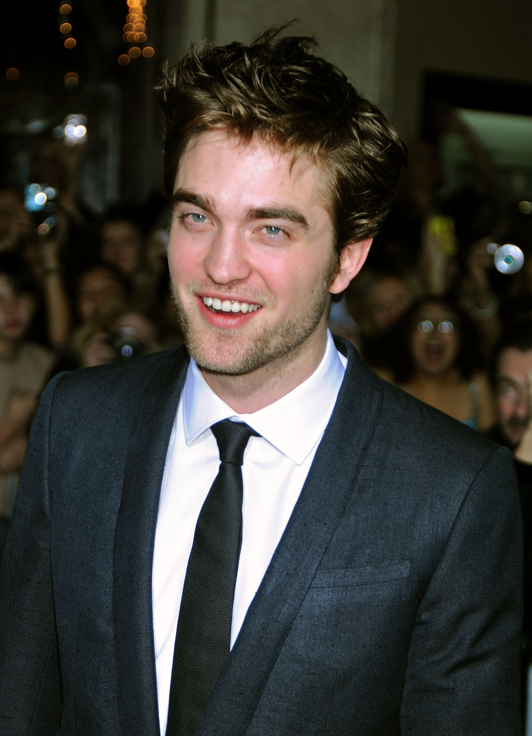 closeup of robert in a suit and tie at an event