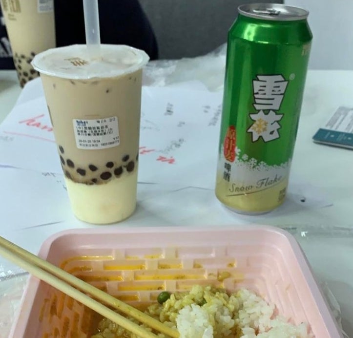 The photographer is showing off their meal, which includes curry rice and milk tea