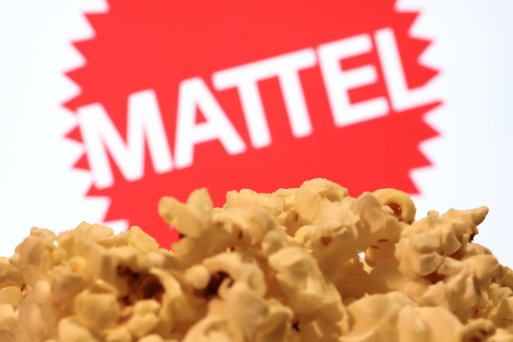 A popcorn and Mattel logo displayed on a movie screen