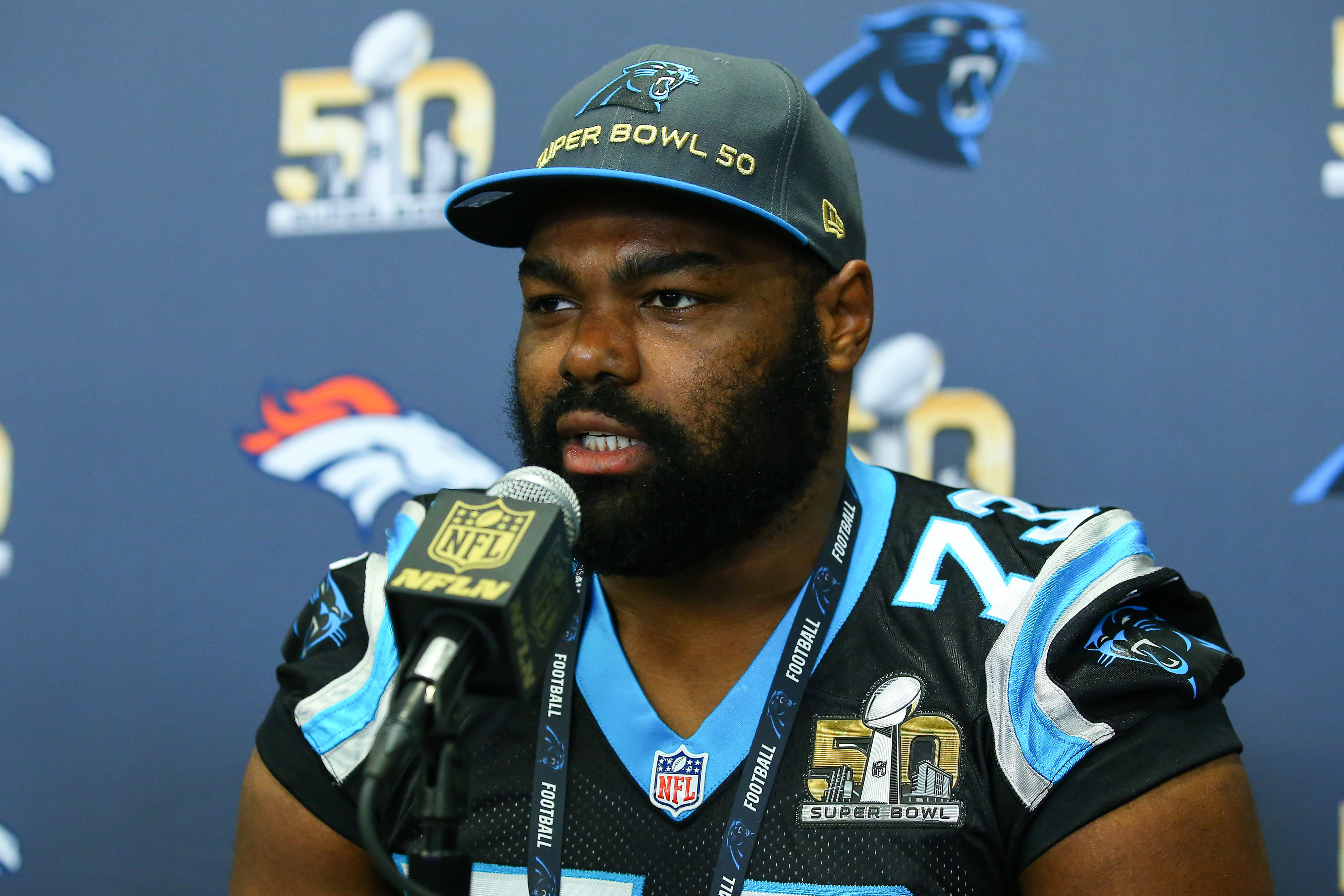 Michael Oher at a press conference for the 50th Super Bowl