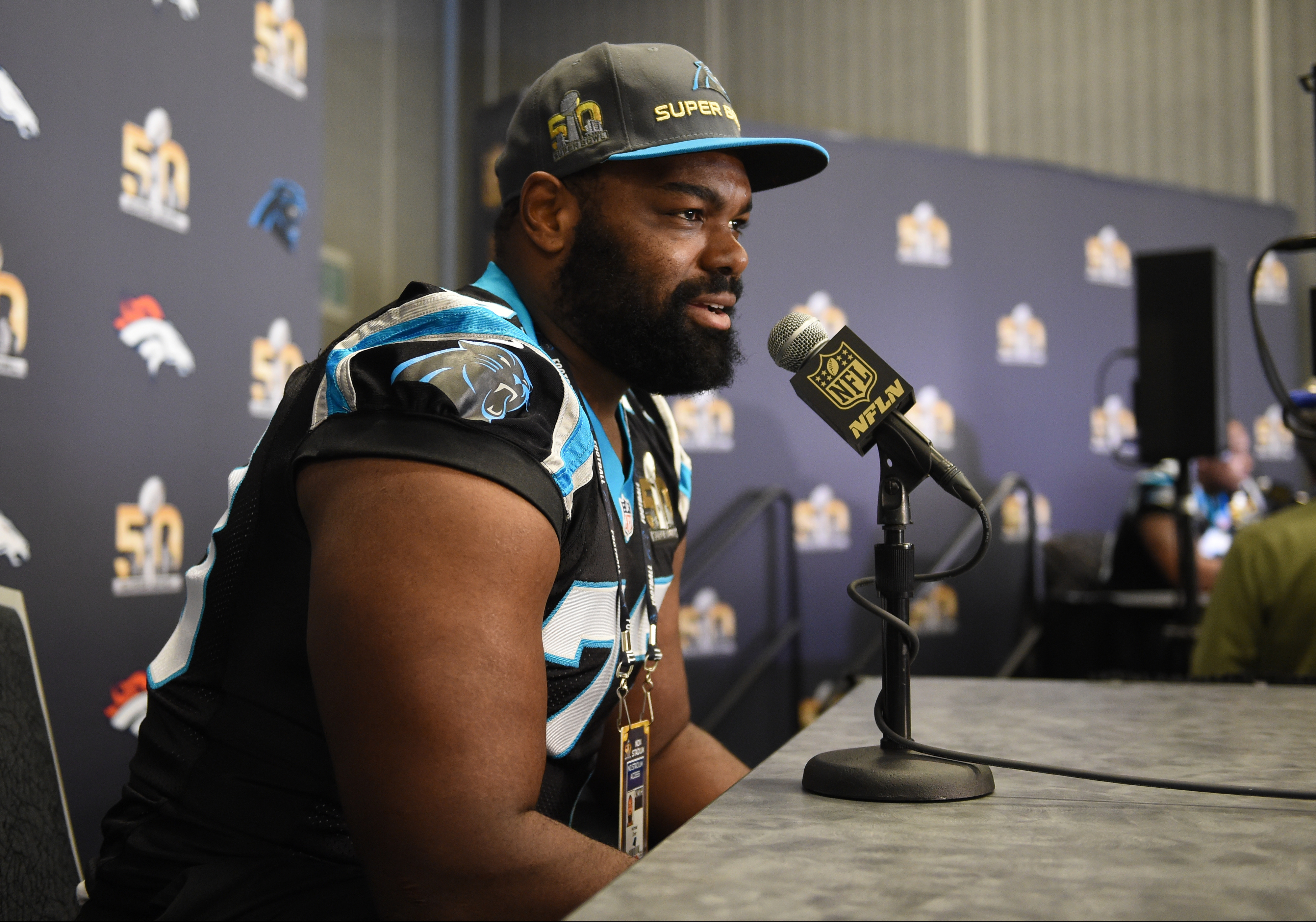 Michael Oher at a press conference during the 50th Super Bowl