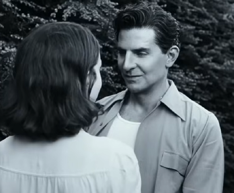 Bradley Cooper looking at a woman in a scene from &quot;Maestro&quot;