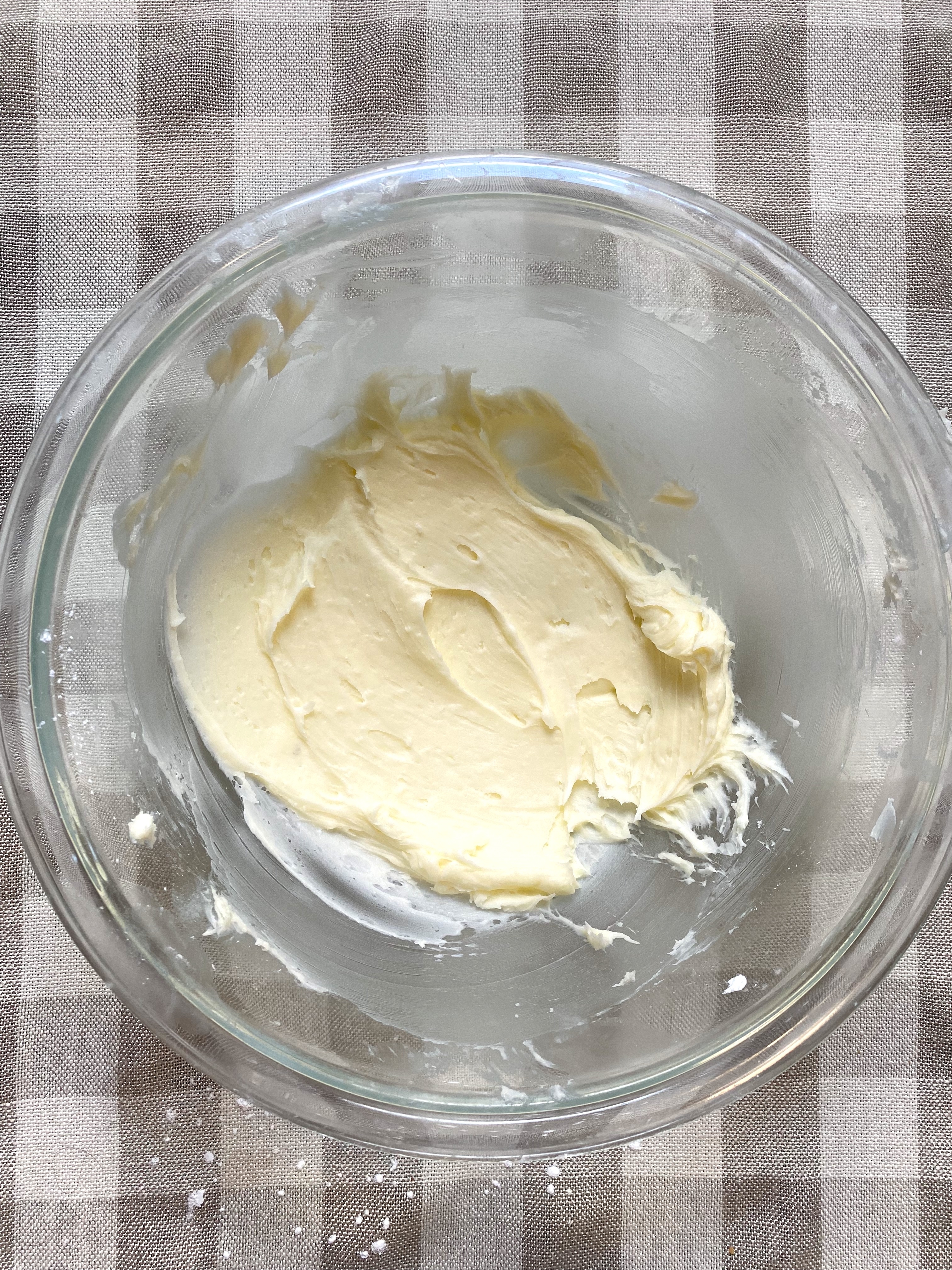 A smooth mixture of butter and sugar in a bowl