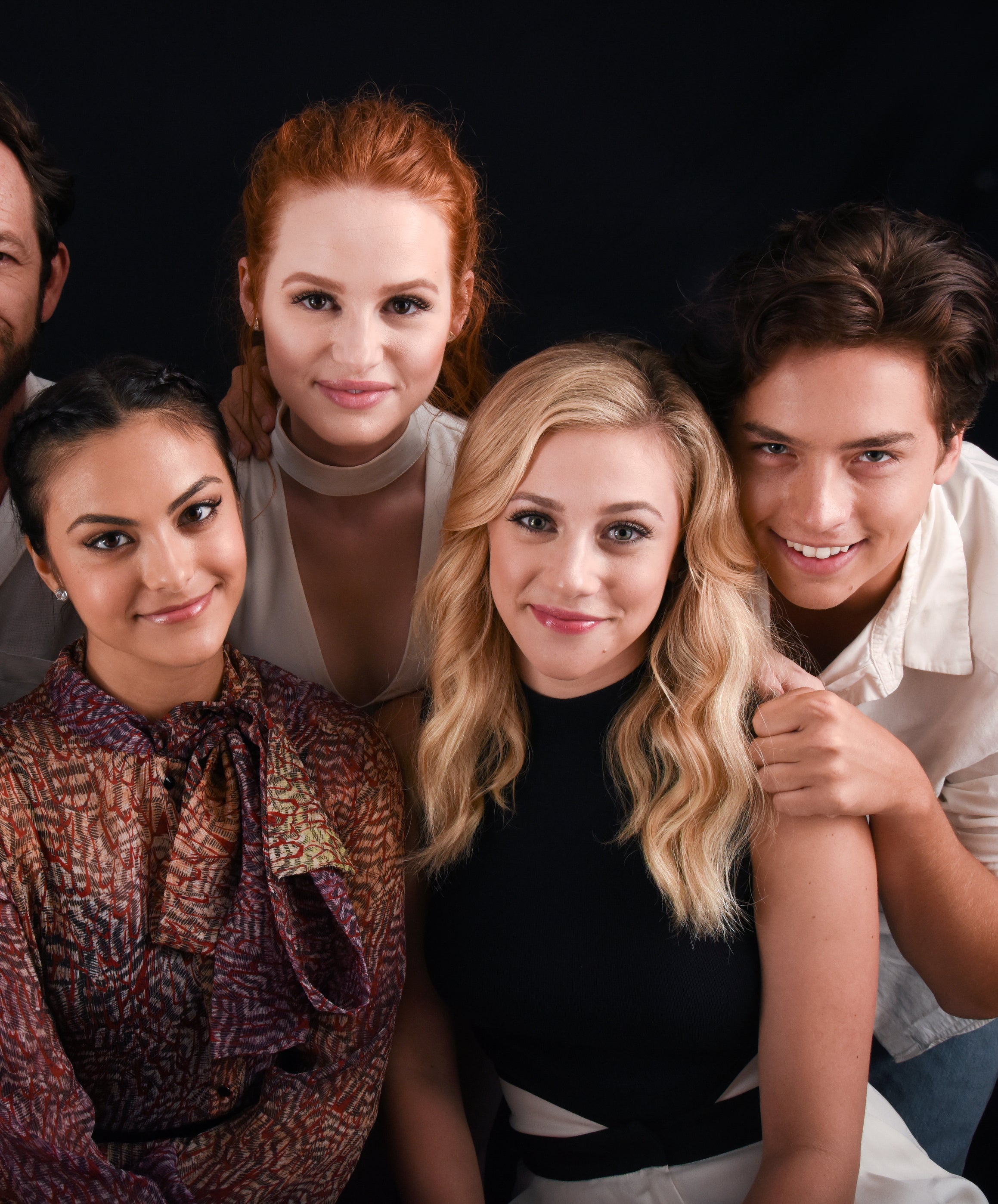 Close-up of the cast members smiling