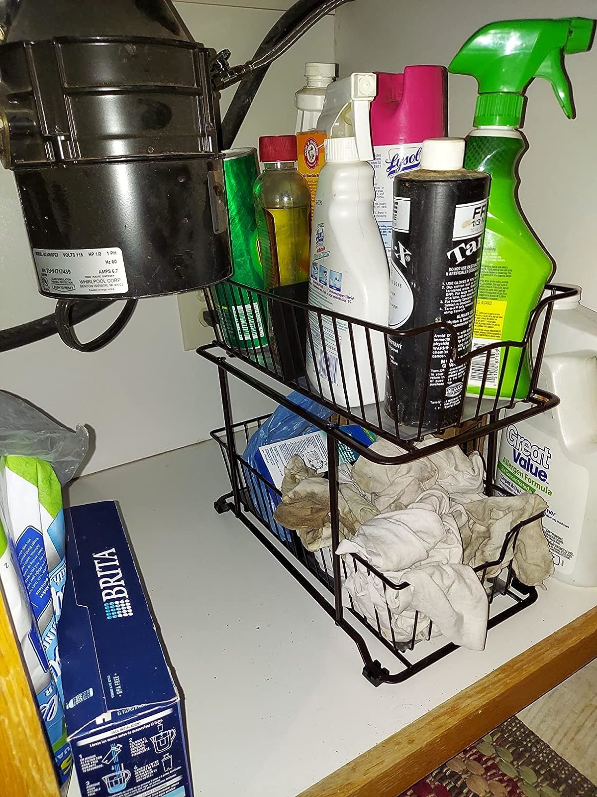 Reviewer image of cleaning supplies inside the wire organizer in a cabinet