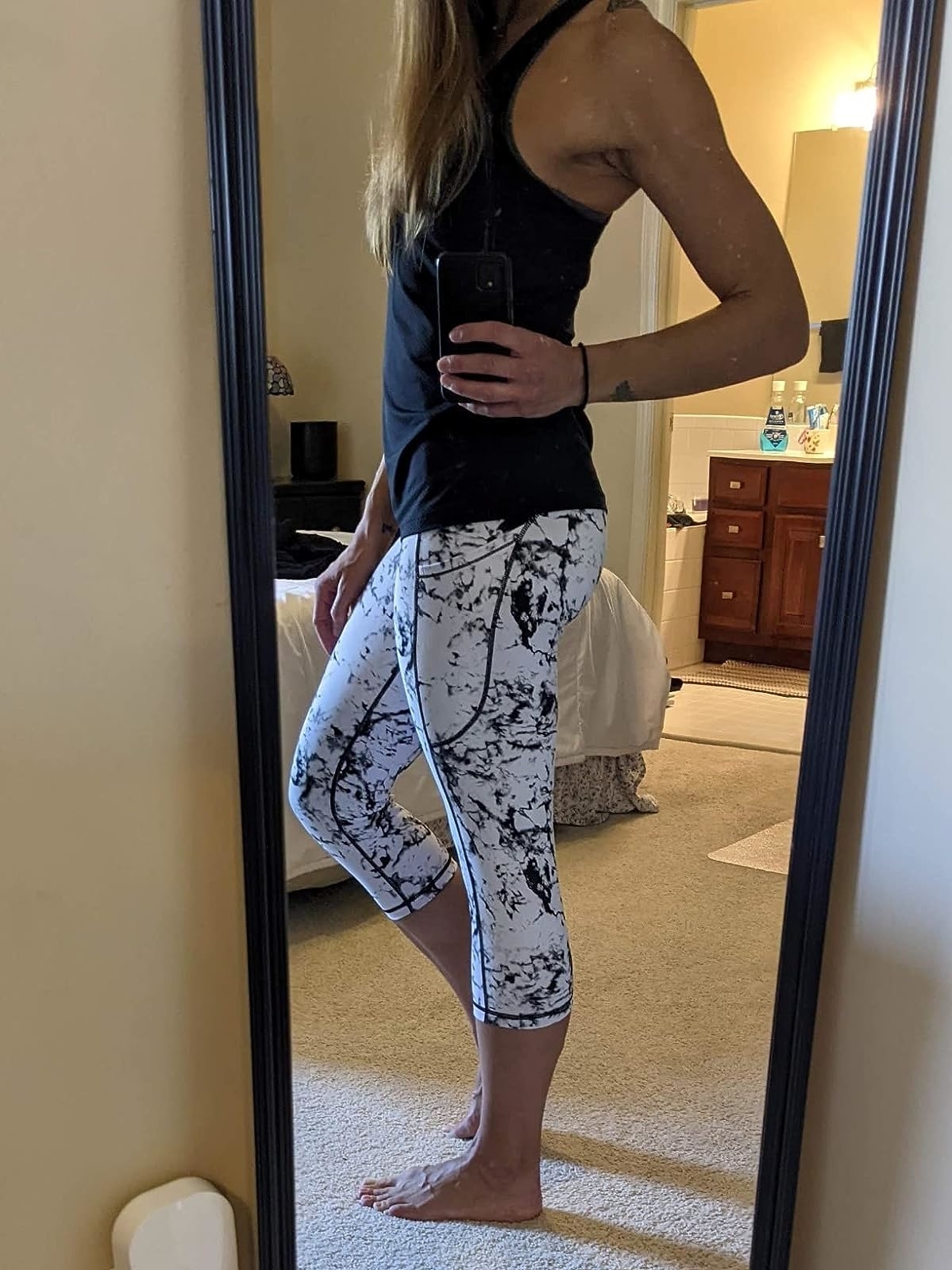 Reviewer wearing the leggings in black and white