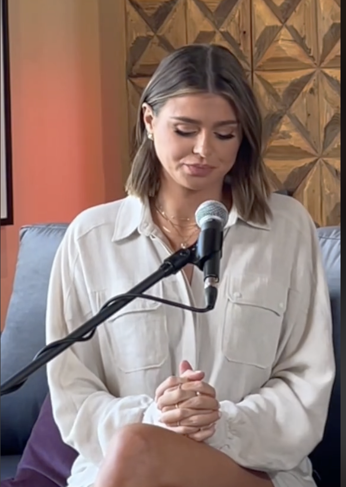 A screencap of Raquel from the podcast of her looking down