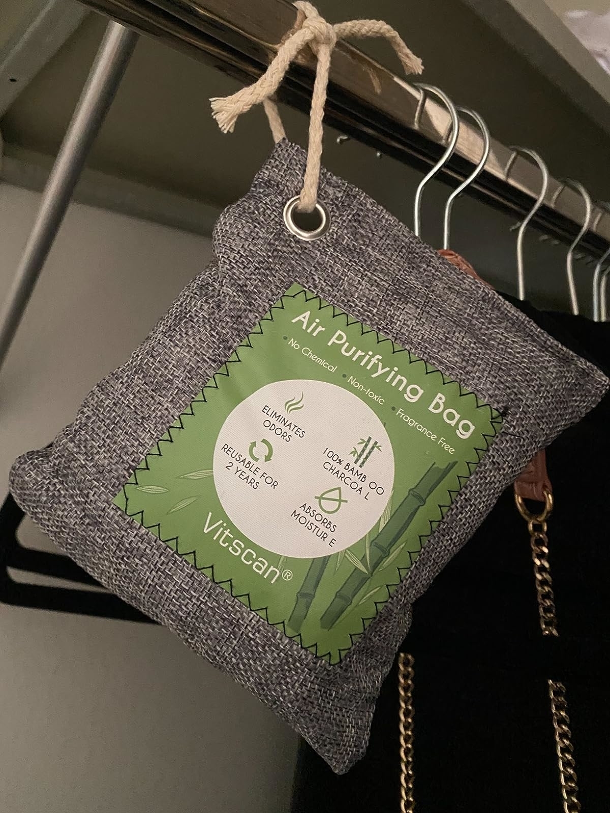 Reviewer image of charcoal odor absorber bag hanging in their closet