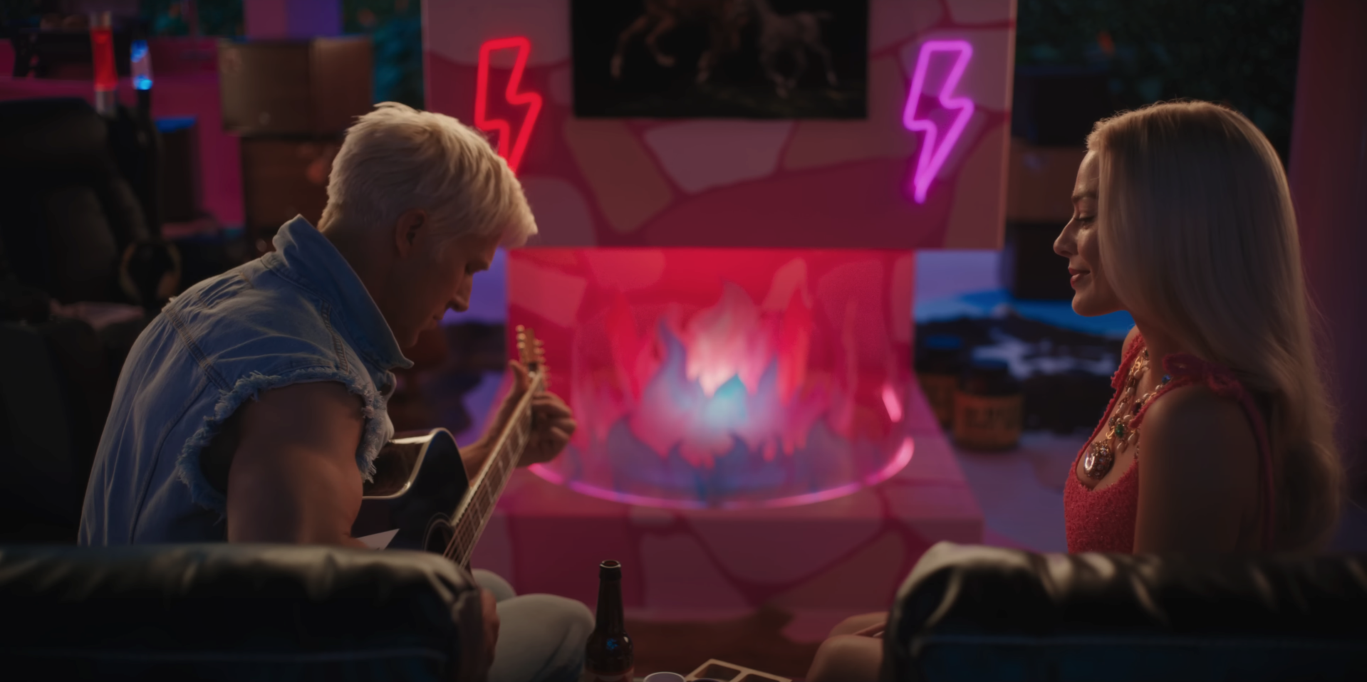 Ryan Gosling as Ken playing the guitar and serenading Barbie in a scene from &quot;Barbie&quot;