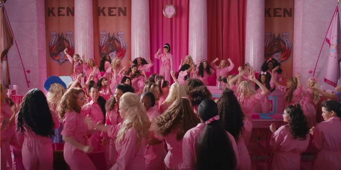 Multiple Barbies celebrating in a scene from &quot;Barbie&quot;